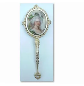 Antique hand mirror with miniature portrait