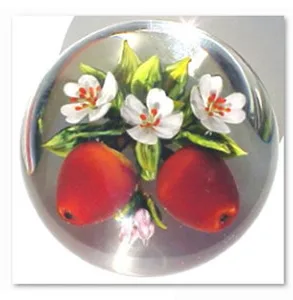 Glass paperweight with flowers and fruit