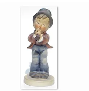 Porcelain figurine of a boy with a horn