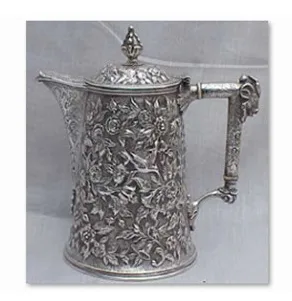 Ornate repouss&eacute; silver pitcher